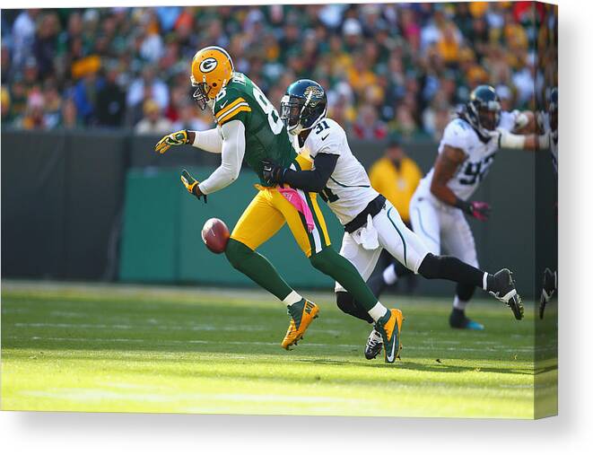 Green Bay Canvas Print featuring the photograph Jacksonville Jaguars v Green Bay Packers #1 by Dilip Vishwanat