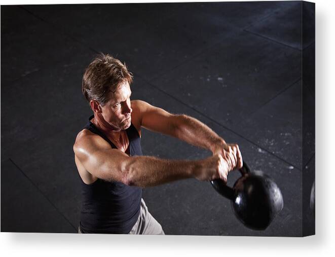 Horizontal Canvas Print featuring the photograph Man working out with kettle bell #1 by Kali9
