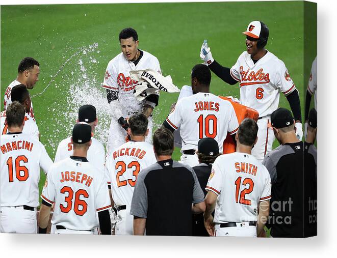 People Canvas Print featuring the photograph Manny Machado, Jonathan Schoop, and Adam Jones by Rob Carr