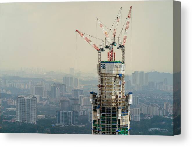 Downtown District Canvas Print featuring the photograph Menara PNB 118 under construction in Kuala Lumpur, Malaysia. #1 by Shaifulzamri