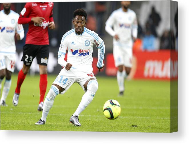 People Canvas Print featuring the photograph Olympique de Marseille v EA Guingamp - Ligue 1 #1 by Jean Catuffe