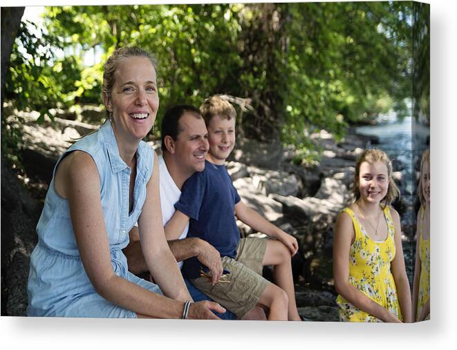 Outdoors Canvas Print featuring the photograph Real family portrait of 4 on riverside in summer. #1 by Martinedoucet