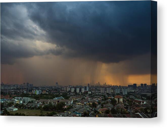 Shielding Canvas Print featuring the photograph Stormy and rainy sunset in downtown Kuala Lumpur #1 by Shaifulzamri