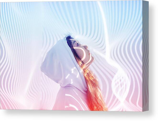 People Canvas Print featuring the photograph Young woman standing in holographic background #1 by Qi Yang