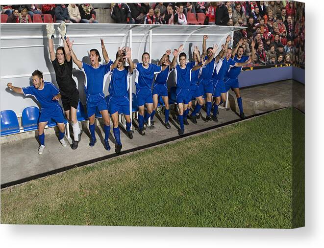 People Canvas Print featuring the photograph Footballers celebrating #2 by Image Source