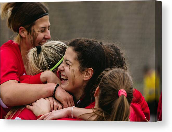 Soccer Uniform Canvas Print featuring the photograph Happy Female Soccer Players Celebrating Goal #2 by Vgajic