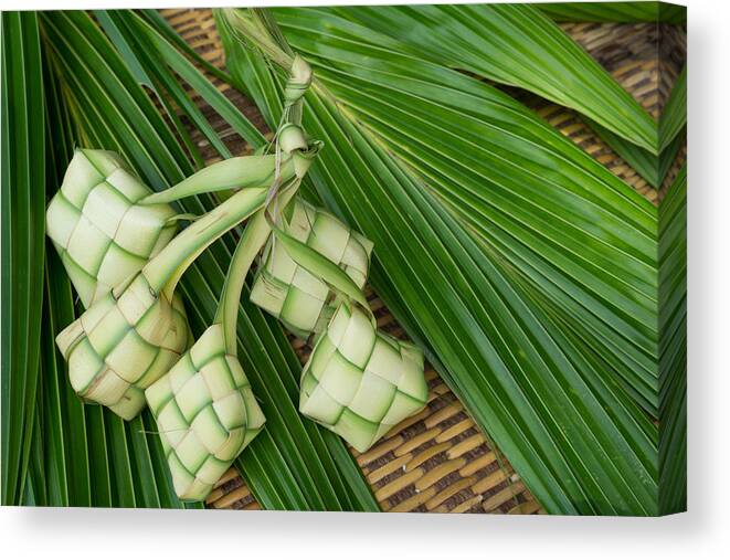 Dumpling Canvas Print featuring the photograph Ketupat, Kupat or Tipat is a type of dumpling made from rice packed inside a diamond-shaped container of woven palm leaf pouch. It is commonly found in Indonesia, Malaysia, Brunei and Singapore. #2 by Shaifulzamri