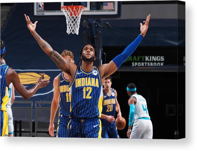 Oshae Brissett Canvas Print featuring the photograph Play-In Tournament - Charlotte Hornets v Indiana Pacers by Ron Hoskins