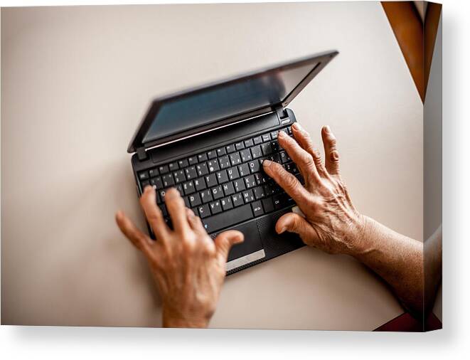 Internet Canvas Print featuring the photograph Senior Woman Learning To Use Computer #2 by CasarsaGuru