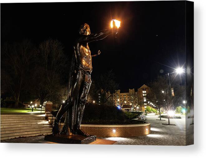 University Of Tennessee At Night Canvas Print featuring the photograph Torchbearer statue at the University of Tennessee at night #2 by Eldon McGraw