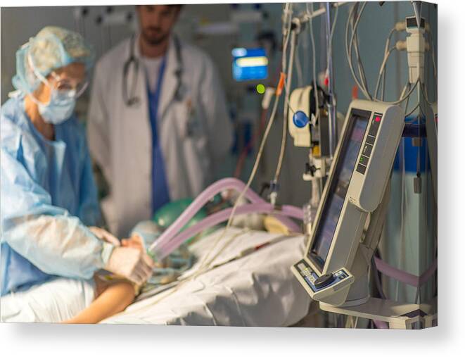 Expertise Canvas Print featuring the photograph Doctor and patient in operating theatre #3 by Simonkr