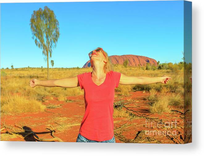 Australia Canvas Print featuring the photograph Tourist woman at Uluru #3 by Benny Marty