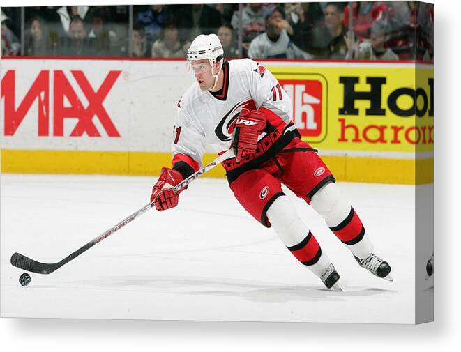 National Hockey League Canvas Print featuring the photograph Carolina Hurricanes v Vancouver Canucks #49 by Jeff Vinnick