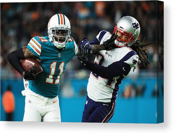Miami Gardens Canvas Print featuring the photograph New England Patriots v Miami Dolphins #5 by Mike Ehrmann