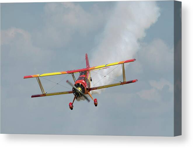 Red Canvas Print featuring the photograph Red and Yellow Airplane by Carolyn Hutchins