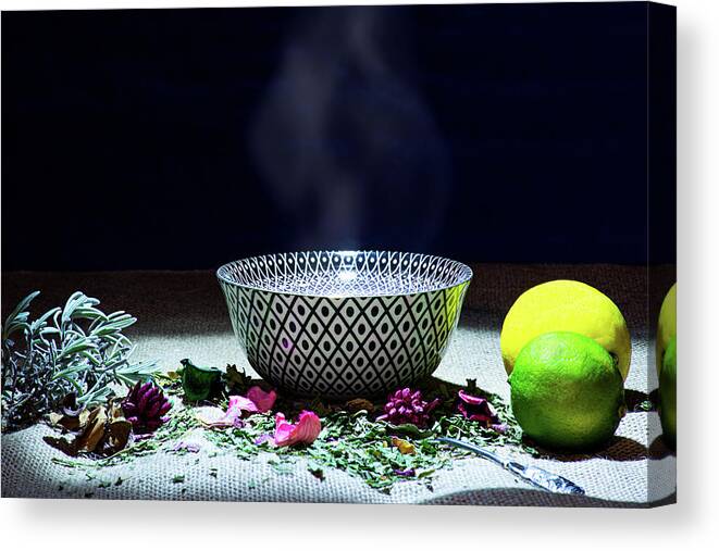 Tea Canvas Print featuring the photograph A drinking bowl with tea and herbs. by Bernhard Schaffer