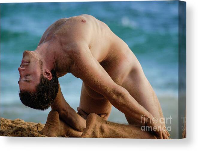 Nude Canvas Print featuring the photograph A handsome flexible male surfer in a difficult yoga pose. by Gunther Allen