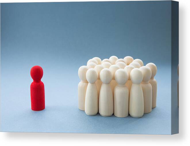 Presentation Canvas Print featuring the photograph A Manager or Leader addressing a group of people or being isolated because of diversity by Teamjackson