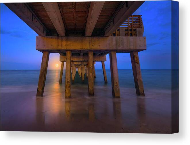Moon Canvas Print featuring the photograph A Moonrise Under the Pier by Mark Andrew Thomas
