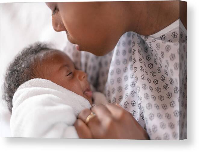 People Canvas Print featuring the photograph A newborn and mother in a hospital by FatCamera