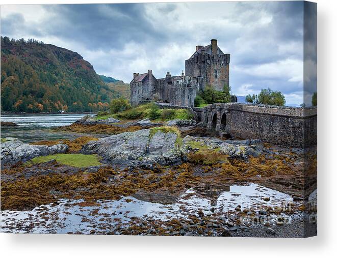 Castle Canvas Print featuring the photograph A storm brews over Eilean Donan Castle, Scotland by Jane Rix