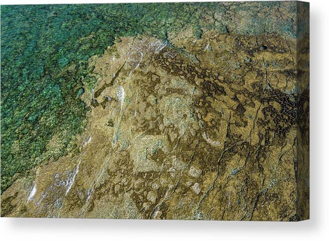 Seascape Canvas Print featuring the photograph Aerial drone view of sea transparent water with rocks on the bottom. Ocean background by Michalakis Ppalis