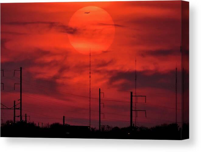 Sunset Canvas Print featuring the photograph Airplane Passing in Front of Setting Sun Over Philadelphia by Linda Stern