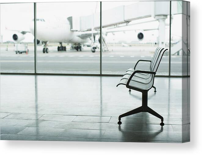 Airplane Canvas Print featuring the photograph Airport lounge by Martin Barraud
