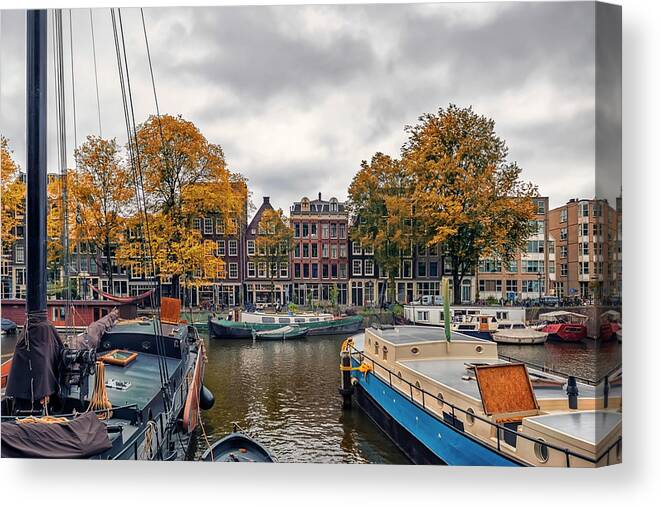 Netherlands Canvas Print featuring the photograph Amsterdam Canal by Manjik Pictures