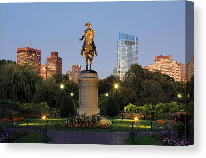 Downtown District Canvas Print featuring the photograph An equestrian statue of George Washington in Boston's Public Garden illuminated at dusk by Rainer Grosskopf
