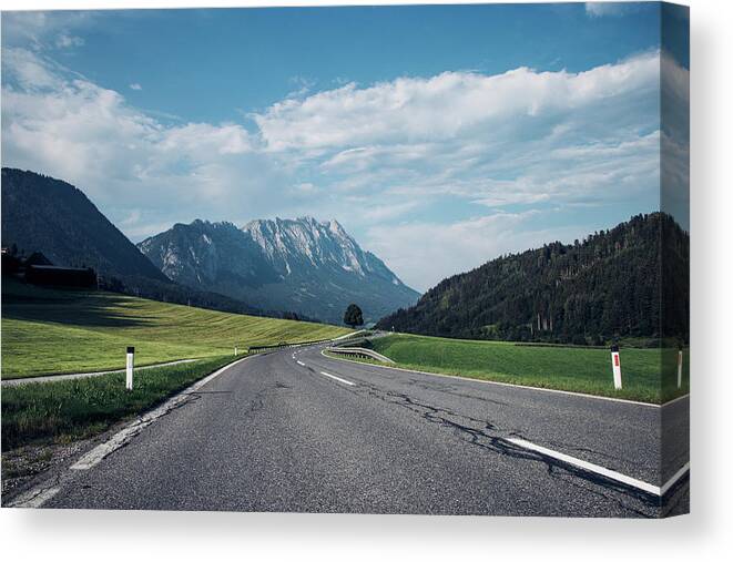 Overcast Canvas Print featuring the photograph Asphalt road in Schladming by Vaclav Sonnek