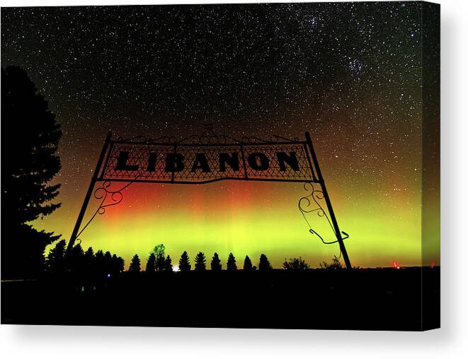 Lutheran Canvas Print featuring the photograph Aurora Borealis at the Lebanon Church cemetery in Benson County ND by Peter Herman
