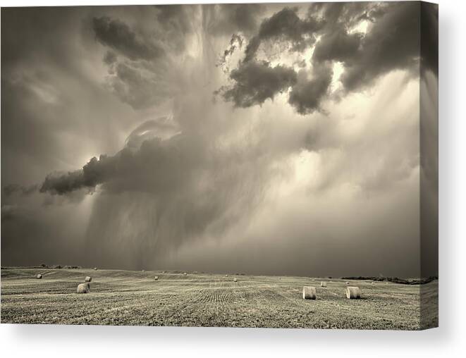Bales Canvas Print featuring the photograph Baelstrom #1 - Approaching storm over ND hayfield and alfala bales by Peter Herman