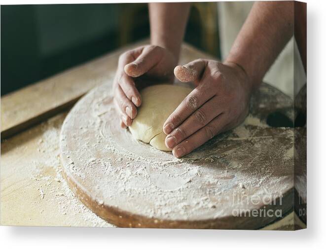 Baker Canvas Print featuring the photograph Baker preparing dough closeup by Jelena Jovanovic