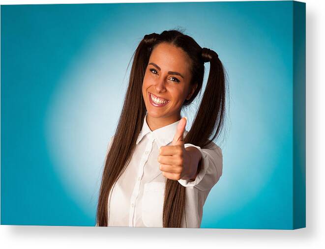 White People Canvas Print featuring the photograph Beautiful hispanic business woman gesturing success shownig thumb up by Samotrebizan