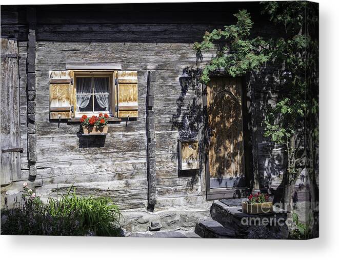 Swiss Wood Cabin Canvas Print featuring the photograph Berghuette - an original Swiss Chalet by Manuela's Camera Obscura