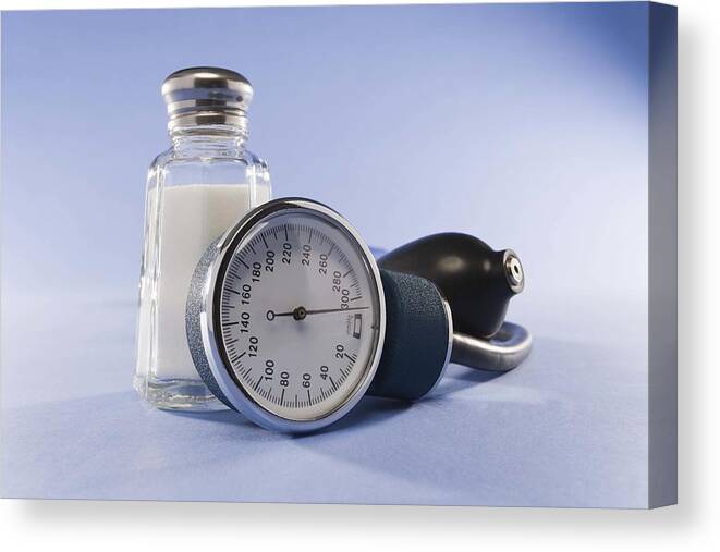 Salt Shaker Canvas Print featuring the photograph Blood pressure cuff and salt by Jupiterimages