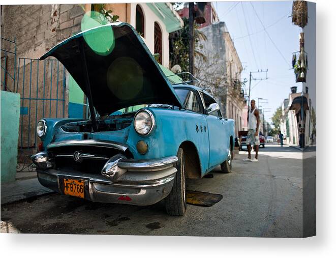 Expertise Canvas Print featuring the photograph Blue oldtimer car with open hood by Merten Snijders