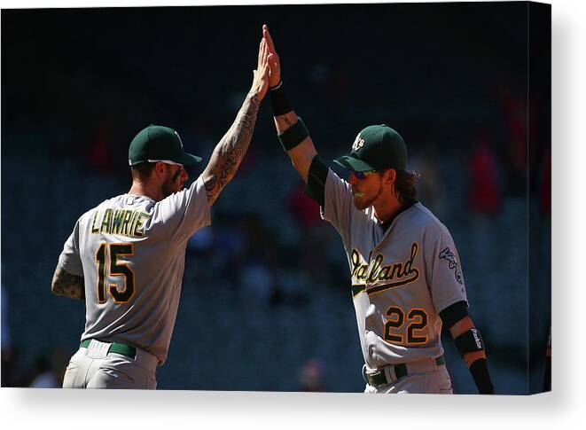 People Canvas Print featuring the photograph Brett Lawrie and Josh Reddick by Victor Decolongon