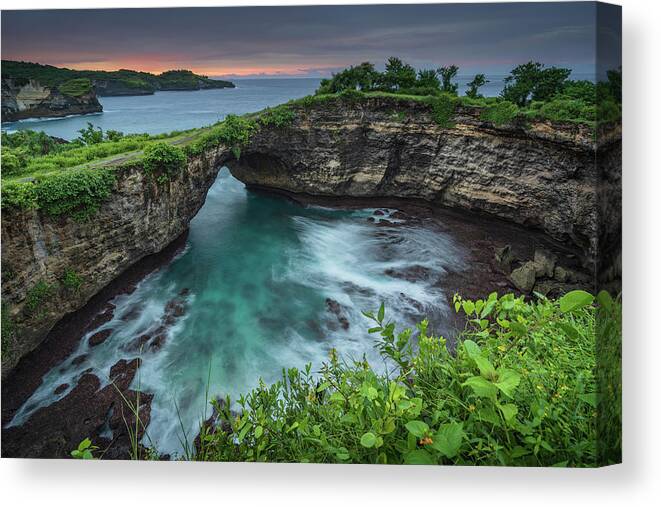 Arch Canvas Print featuring the photograph Broken beach on Nusa Penida in Bali at sunrise. by Anges Van der Logt