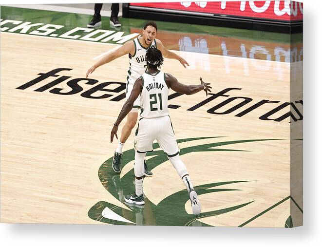 Bryn Forbes Canvas Print featuring the photograph Bryn Forbes and Jrue Holiday by Kamil Krzaczynski