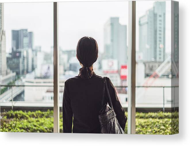 Anxiety Canvas Print featuring the photograph Businesswoman and big city by Ah86