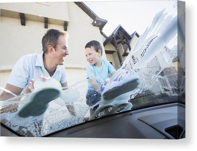 4-5 Years Canvas Print featuring the photograph Caucasian father and son washing car windshield by Mike Kemp
