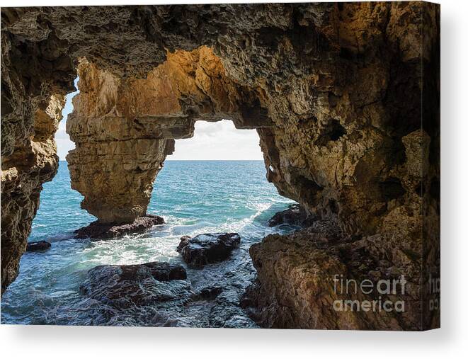Coast Canvas Print featuring the photograph Cave on the Mediterranean coast, Cova del Arcs by Adriana Mueller