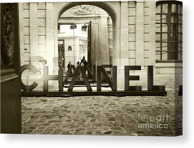 Chanel shop in old Marais quarter in Paris. Sepia photo Canvas Print