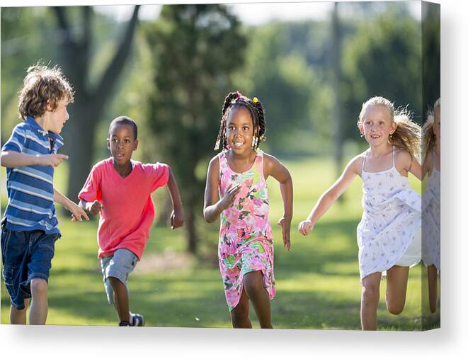 Asian And Indian Ethnicities Canvas Print featuring the photograph Children Running Through the Park by FatCamera