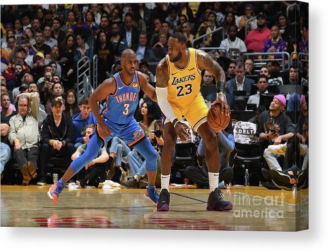 Nba Pro Basketball Canvas Print featuring the photograph Chris Paul and Lebron James by Andrew D. Bernstein