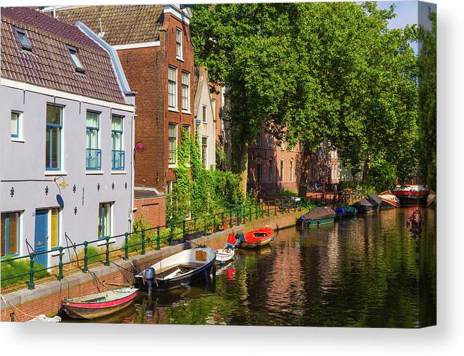 City Canvas Print featuring the photograph City canal in Amsterdam by Fabiano Di Paolo
