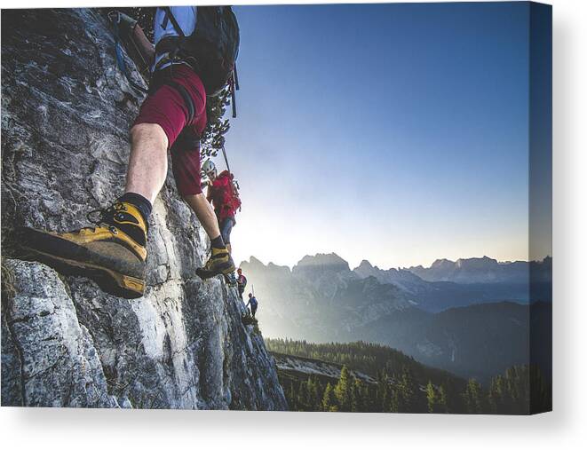 Young Men Canvas Print featuring the photograph Climbing on the mountaing edge by Ziga Plahutar