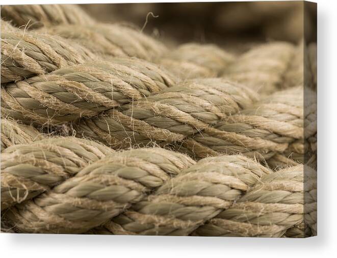 Fiber Canvas Print featuring the photograph Close-up of an old frayed boat rope as a background by R.Tsubin